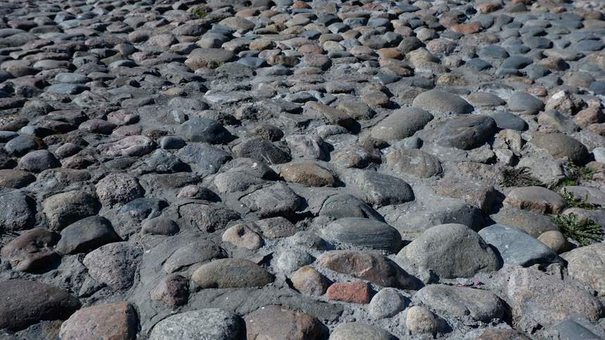 Rounded river cobbles set close together