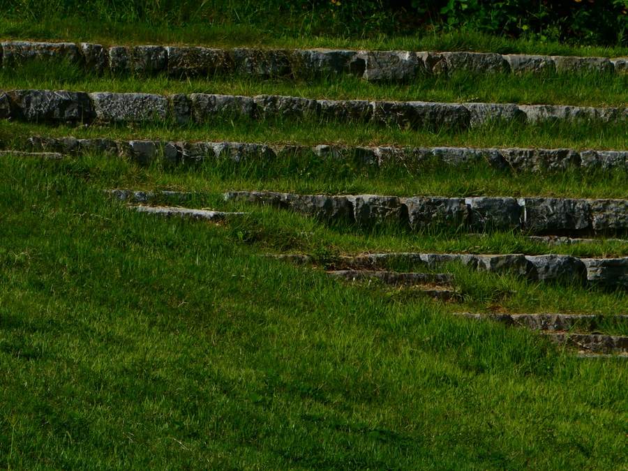 Grass terraces held by long courses of old stone edging