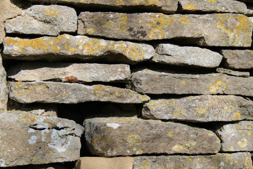 Dry stone walling with lichen on weathered limestone